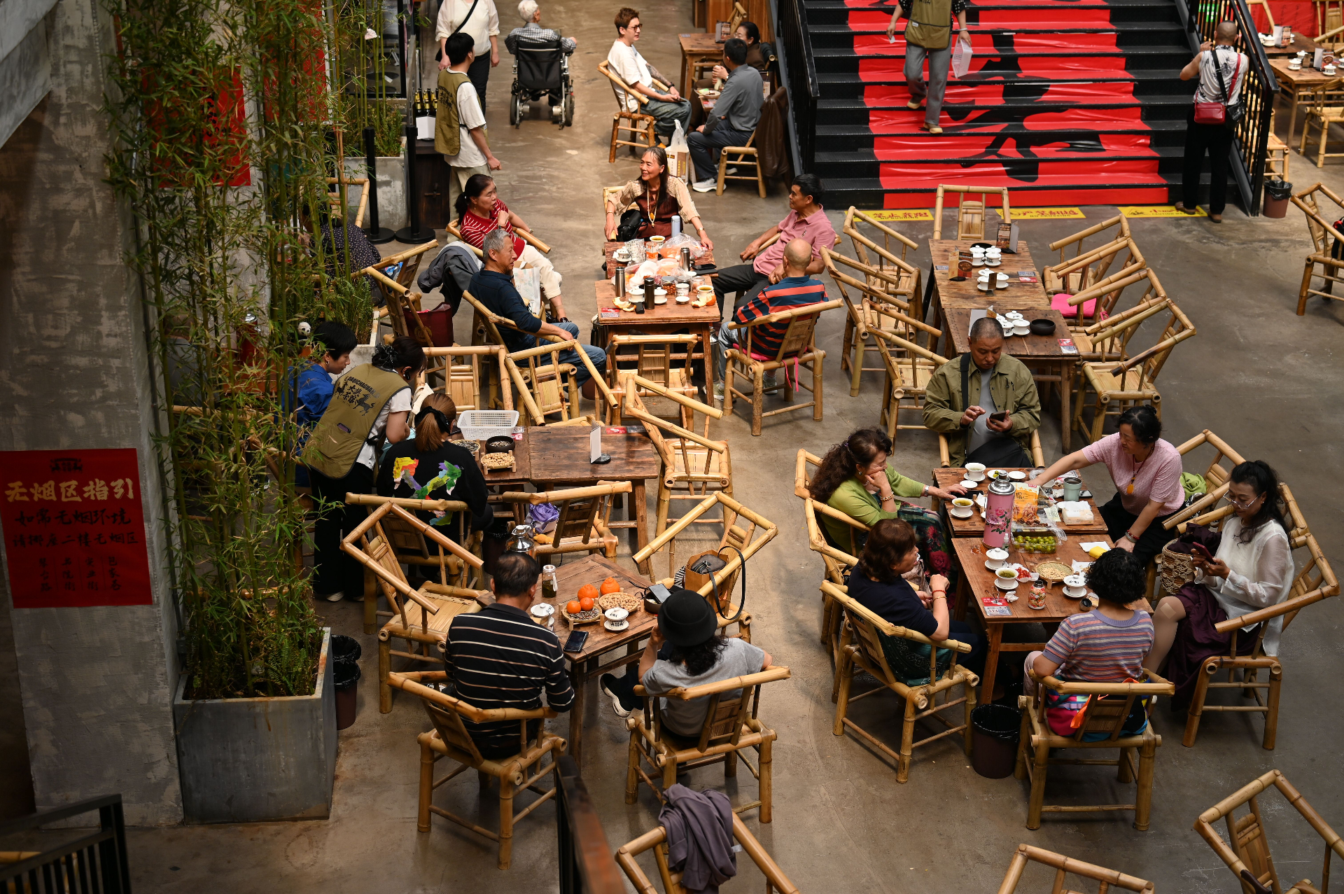 A busy restaurant team is seen efficiently preparing takeout orders during a dinner rush, showcasing their dedication to customer satisfaction and streamlined operations. The scene highlights the importance of boosting restaurant sales through effective online ordering and delivery services for both existing and new customers.