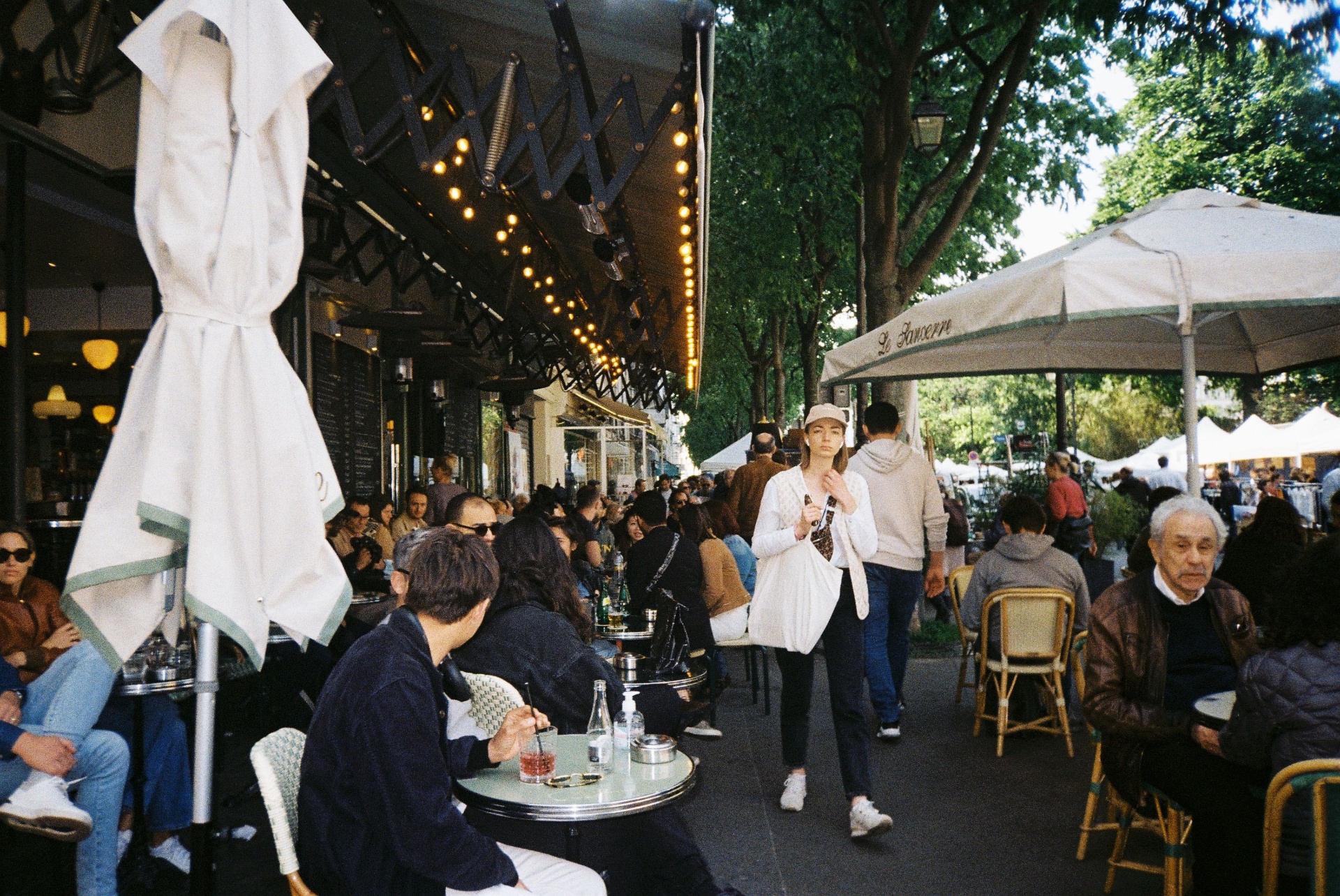 The image depicts a busy restaurant counter bustling with staff assisting guests and organizing pickup bags, highlighting the restaurant's focus on customer satisfaction and efficient service. This scene reflects the vibrant atmosphere of a local business aiming to boost sales and attract both new and loyal customers through streamlined operations and effective marketing efforts.